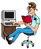 Man working on computer while holding manual in one hand